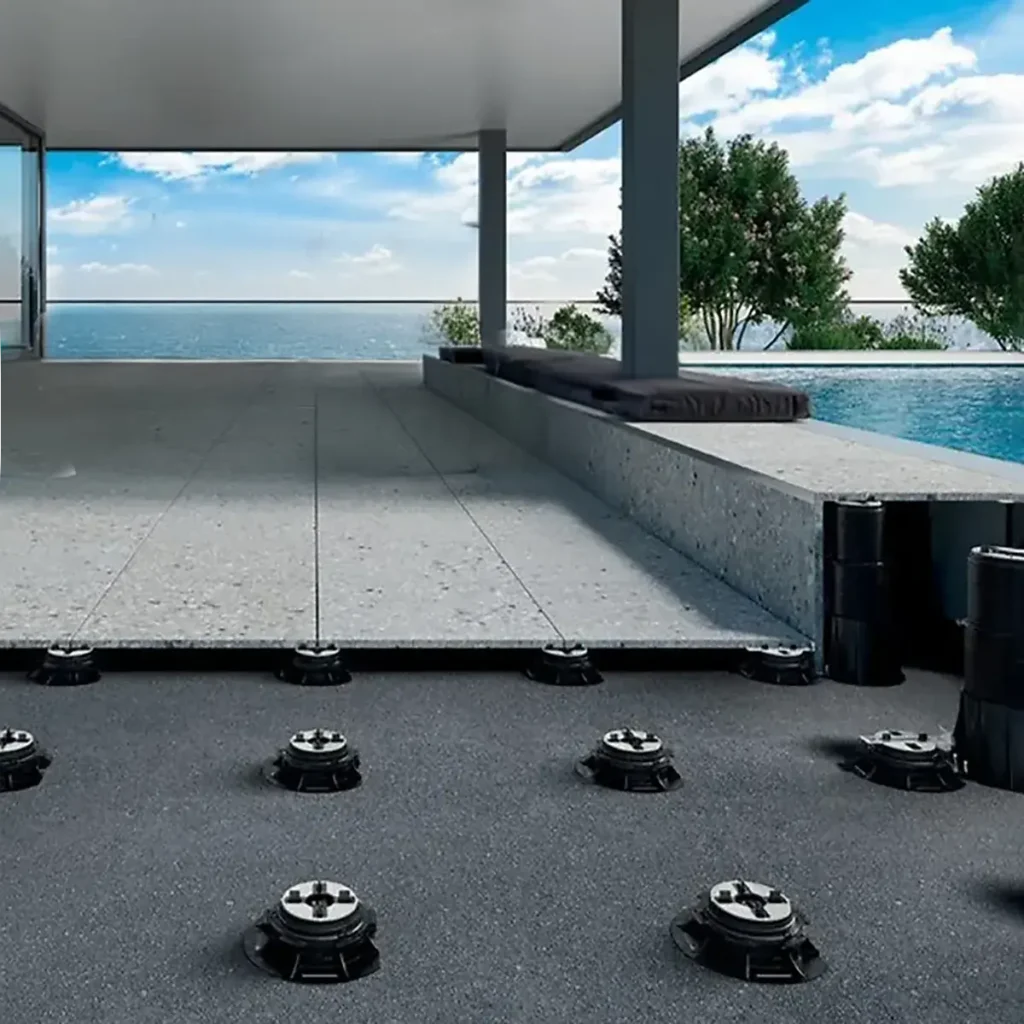 Adjustable pedestal systems with tiles on the EPDM roof, terrace with sea views.