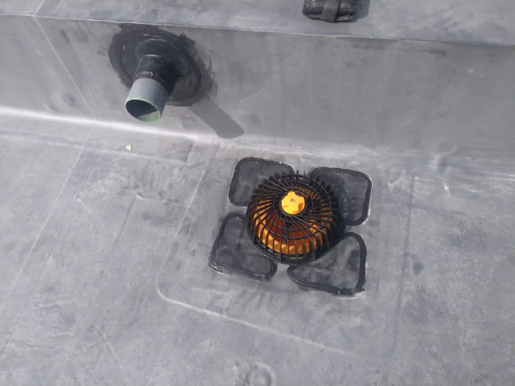 Outlet drain and heated cable passage